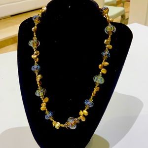 a beautiful necklace with earrings real stone